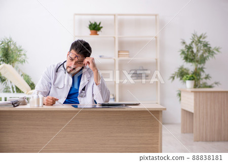 Young male doctor working in the clinic 88838181