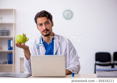 Young male doctor in planning retirement concept Young male doctor in planning retirement concept 88838211