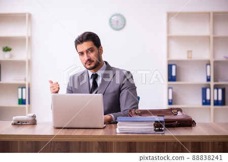 Young businessman employee working in the office Young businessman employee working in the office 88838241