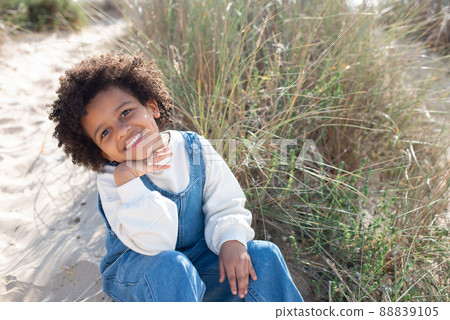 Portrait of charming African American girl on beach Portrait of charming African American girl on beach 88839105