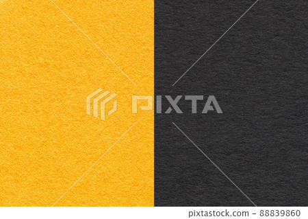 Texture of craft black and yellow paper background, half two colors, macro. Structure of vintage craft cardboard 88839860