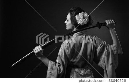 Attractive woman in traditional Japanese kimono with katana ( japanese sword). 88840326