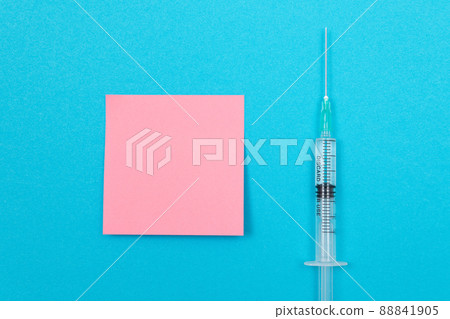 Vaccination or Revaccination Concept - A Medical Syringe on Blue Table 88841905