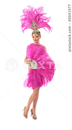 Beautiful cabaret dancers in costumes with rhinestones and purple feathers isolated on white. 88841977
