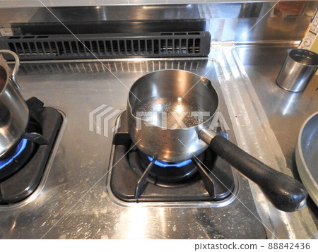 Put a pot on a gas fire, cook a hot pot Put a pot on a gas fire, cook a hot pot 88842436