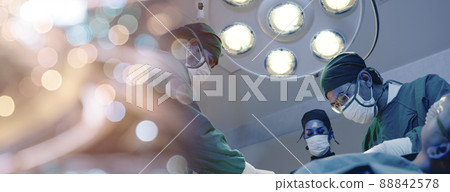 Medical surgical doctor team performing surgery patient Medical surgical doctor team performing surgery patient 88842578