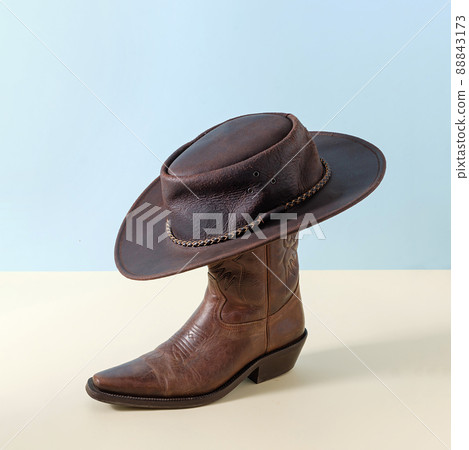 Boot shoes and texas wild west american cowboy hat as minimal concept poster 88843173