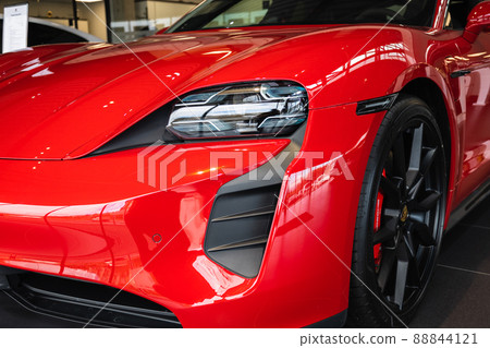 Red Porsche Taycan 4s front left view 88844121