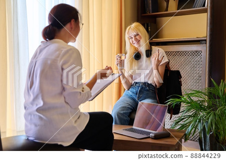 Therapy session of a teenage student girl, professional help of a psychologist. Therapy session of a teenage student girl, professional help of a psychologist. 88844229