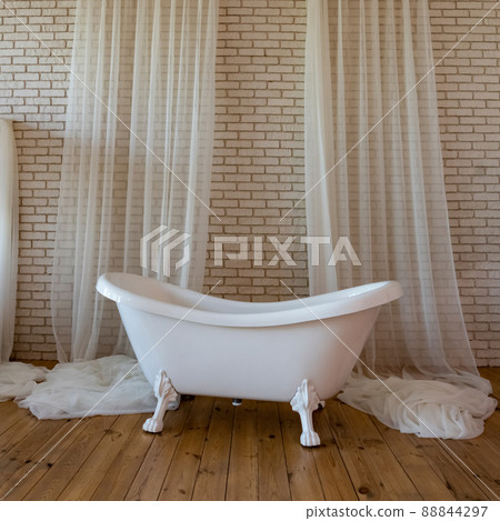 Fashionable bathtub with curtains close-up Fashionable bathtub with curtains close-up 88844297