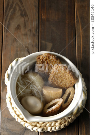 A bird's-eye view of hot oden for one person containing boiled eggs, radishes, chikuwa, Jakoten, Shirataki, and kamaboko. 88845146