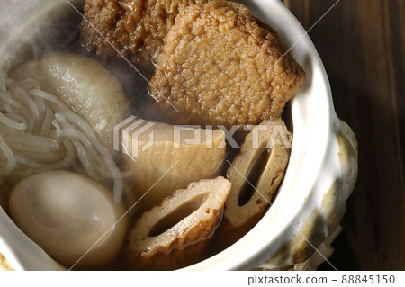 A bird's-eye view of hot oden for one person containing boiled eggs, radishes, chikuwa, Jakoten, Shirataki, and kamaboko. 88845150