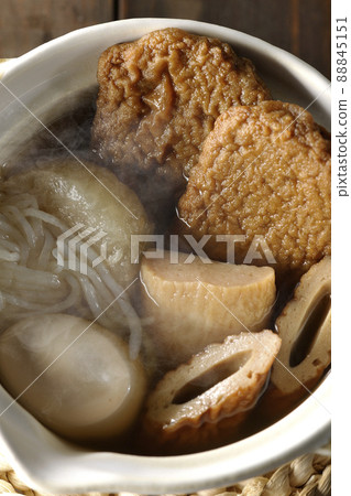 A bird's-eye view of hot oden for one person containing boiled eggs, radishes, chikuwa, Jakoten, Shirataki, and kamaboko. 88845151