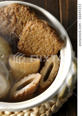 A bird's-eye view of hot oden for one person containing boiled eggs, radishes, chikuwa, Jakoten, Shirataki, and kamaboko. 88845153