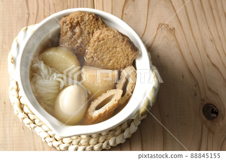 A bird's-eye view of hot oden for one person containing boiled eggs, radishes, chikuwa, Jakoten, Shirataki, and kamaboko. 88845155