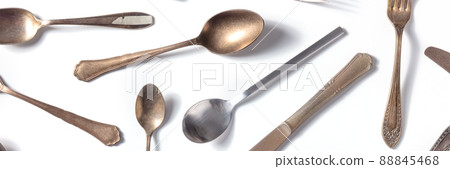 Cutlery pattern panorama. Various forks, knives, and spoons, elegant silverware Cutlery pattern panorama. Various forks, knives, and spoons, elegant silverware 88845468