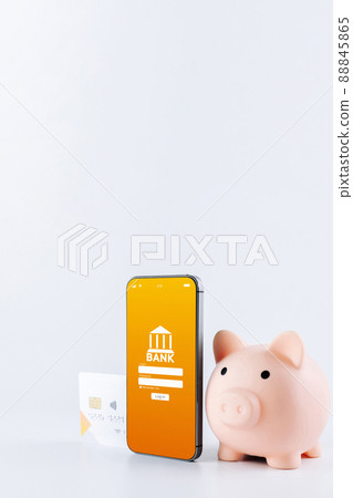 Online banking. Mobile phone with internet online bank app. Pig bank with credit card on white background. Save money business wallet. Online banking. Mobile phone with internet online bank app. Pig bank with credit card on white background. Save money business wallet. 88845865