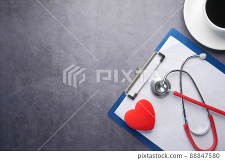high angle view of pills , keyboard and stethoscope on clinic desk . high angle view of pills , keyboard and stethoscope on clinic desk . 88847580