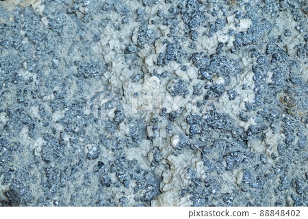 The mineral galena. Close-up, background and texture of the mineral The mineral galena. Close-up, background and texture of the mineral 88848402