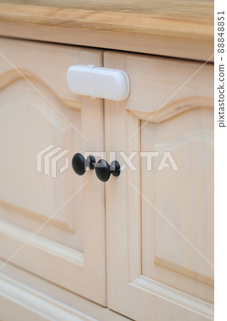 Baby guard attached to the door of the TV board 88848851