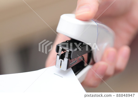 OL woman's hand stapled documents OL woman's hand stapled documents 88848947