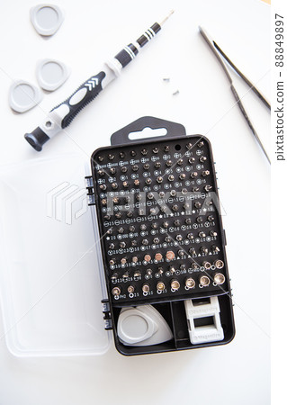 Set of screwdriver bits. Metal bits and adapters for screwdriver boxes. A set of tools for home use. 88849897