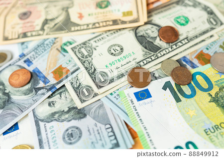 Multicurrency banknotes, coins. The concept of the world economy during the crisis. Money rules in world events, the stock exchange and the trade link between countries. 88849912