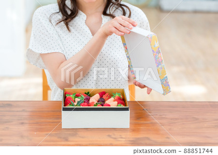 Female with an assortment of fruits 88851744