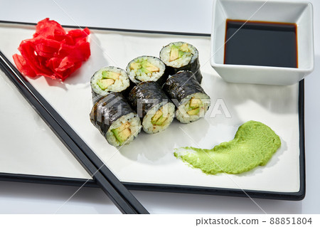 Sushi rolls and chopsticks on white background, space for text. Japanese food 88851804