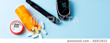White pills on blue background 88853632