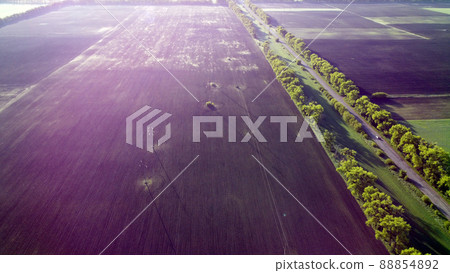 Fields in early spring summer morning from great height. Aerial drone view 88854892