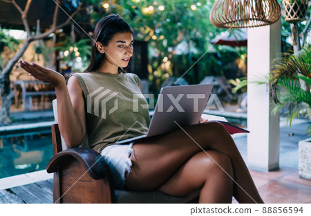Surprised female browsing laptop during work Surprised female browsing laptop during work 88856594