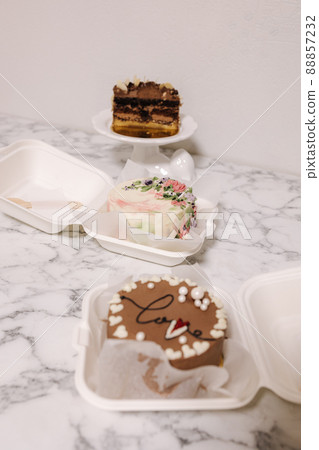 Three different bento cake on white table. Small bento cake for one person as a gift for the holiday 88857232