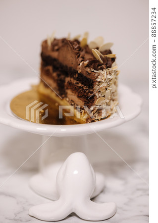 Hulf of chocolate bento cake. Presentation cake on Easter bunny stand. Cake in section Hulf of chocolate bento cake. Presentation cake on Easter bunny stand. Cake in section 88857234