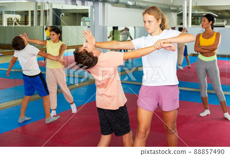 Self-defense lesson for children - girl stabs boy in head 88857490