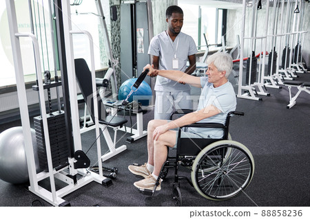 Senior Patient in Wheelchair at Rehabilitation Gym 88858236