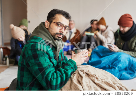 Portrait of Man with Hot Drink in Shelter 88858269