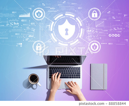 Cyber security theme with person using a laptop 88858844