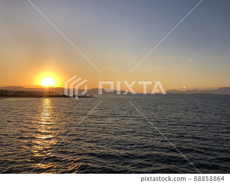 Golden Beautiful sunset at the seaside, Greece 88858864