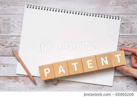 Image of patent | Building blocks, notebooks, pens, hands with "PATENT" written on them 88860206