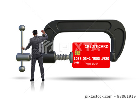 Concept of credit card debt with clamp and businessman 88861919