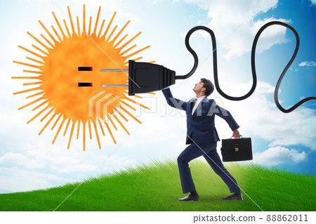Businessman in solar energy concept 88862011