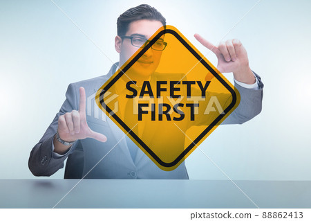 Safety first concept with businessman Safety first concept with businessman 88862413