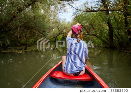 Canoeing on a lake Canoeing on a lake 88863390