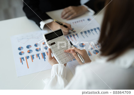 Business People Meeting to analyse and discuss and brainstorming the financial report chart data in office Financial advisor teamwork and accounting concept Business People Meeting to analyse and discuss and brainstorming the financial report chart data in office Financial advisor teamwork and accounting concept 88864709