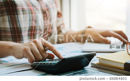 Business woman working in finance and accounting Analyze financial budget in the office Business woman working in finance and accounting Analyze financial budget in the office 88864801