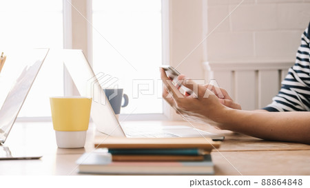 Close up of a man using mobile smart phone 88864848