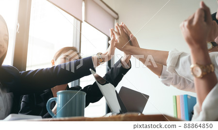 Successful entrepreneurs, Business colleagues celebrating successful at office Successful entrepreneurs, Business colleagues celebrating successful at office 88864850