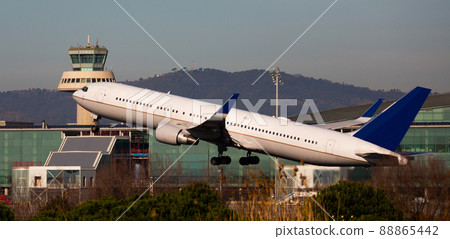 Airplane takes off from airport Barcelona 88865442