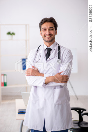 Young male doctor working in the clinic Young male doctor working in the clinic 88866093